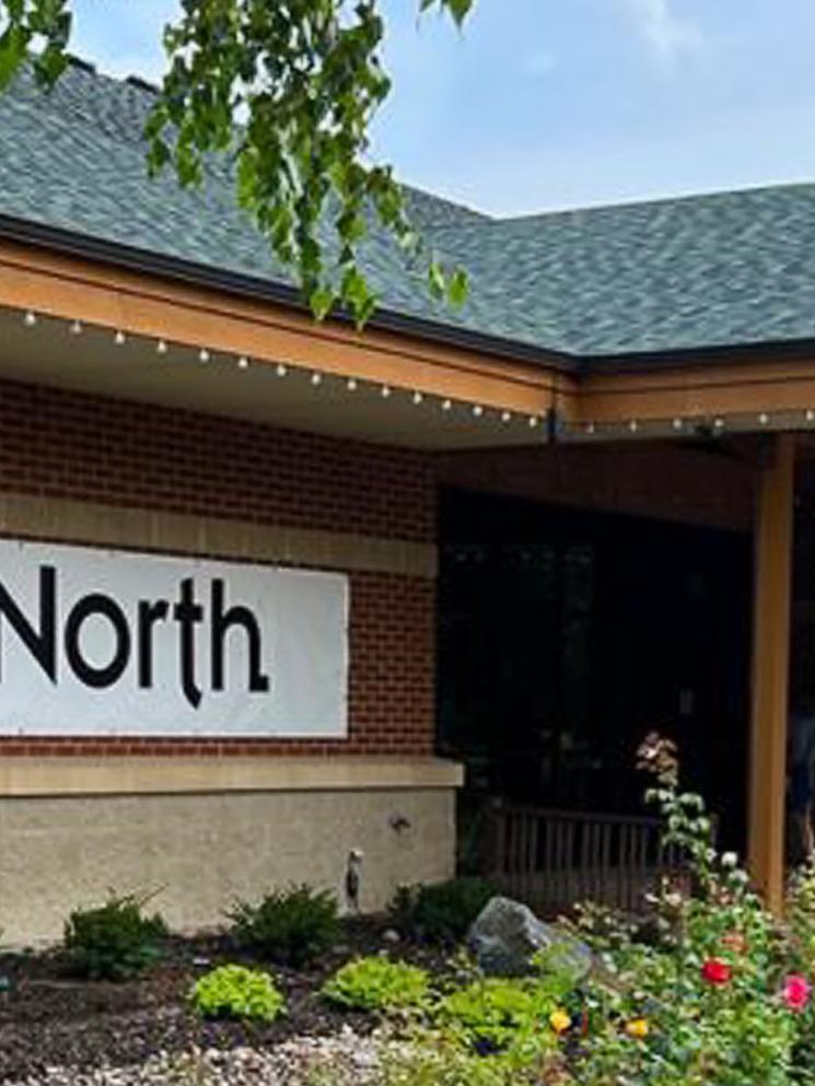 Photo of the front of the building with new logo and name