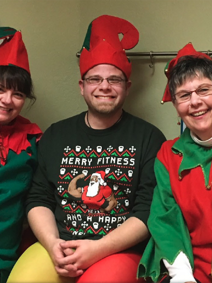 Elaine Meyers, Craig Swenson, and Lynne Pederson in elf costumes