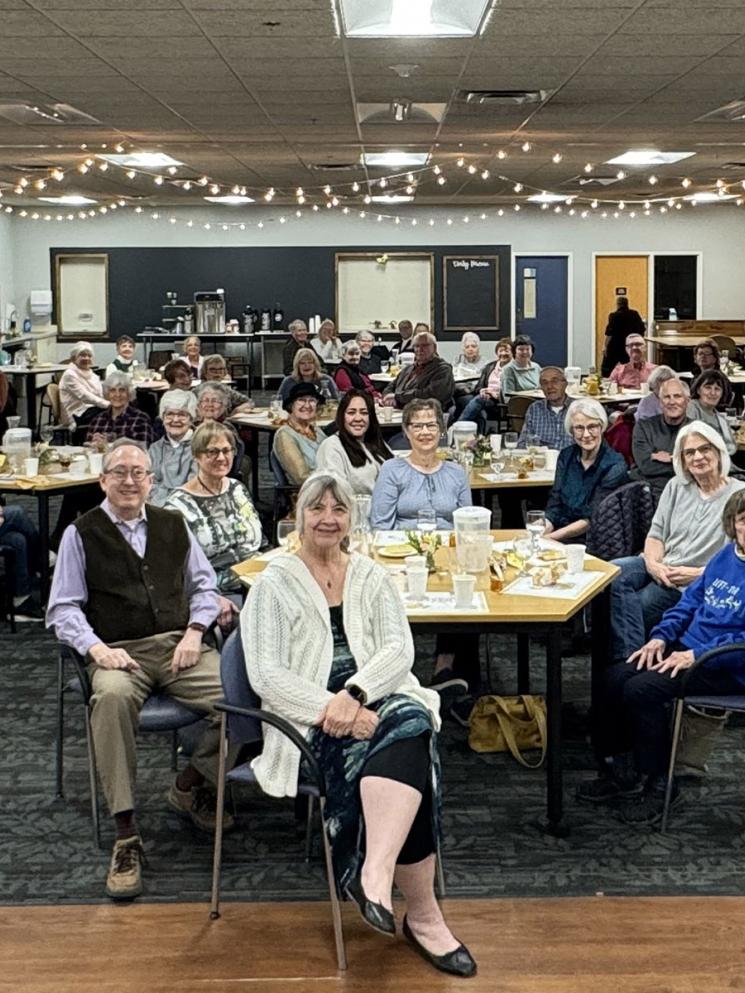 Many people seated at tables