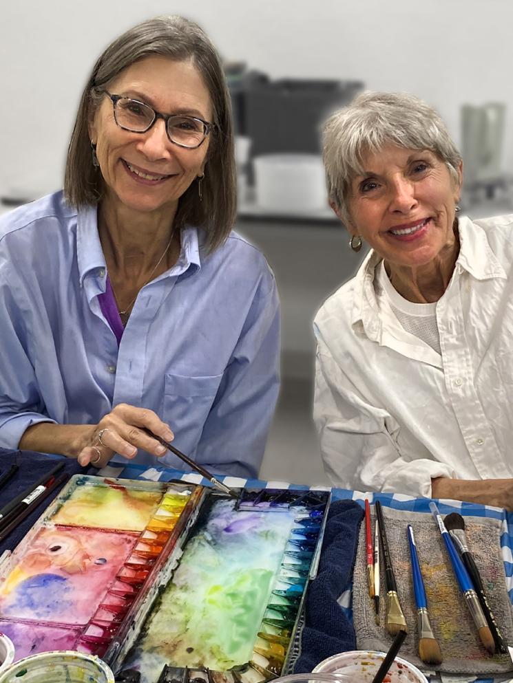 Two women doing wwatercolor painting