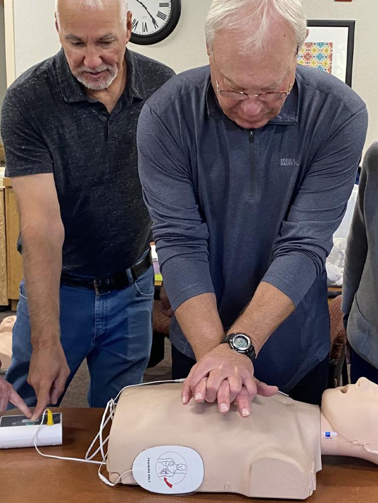Men and women in a CPR class