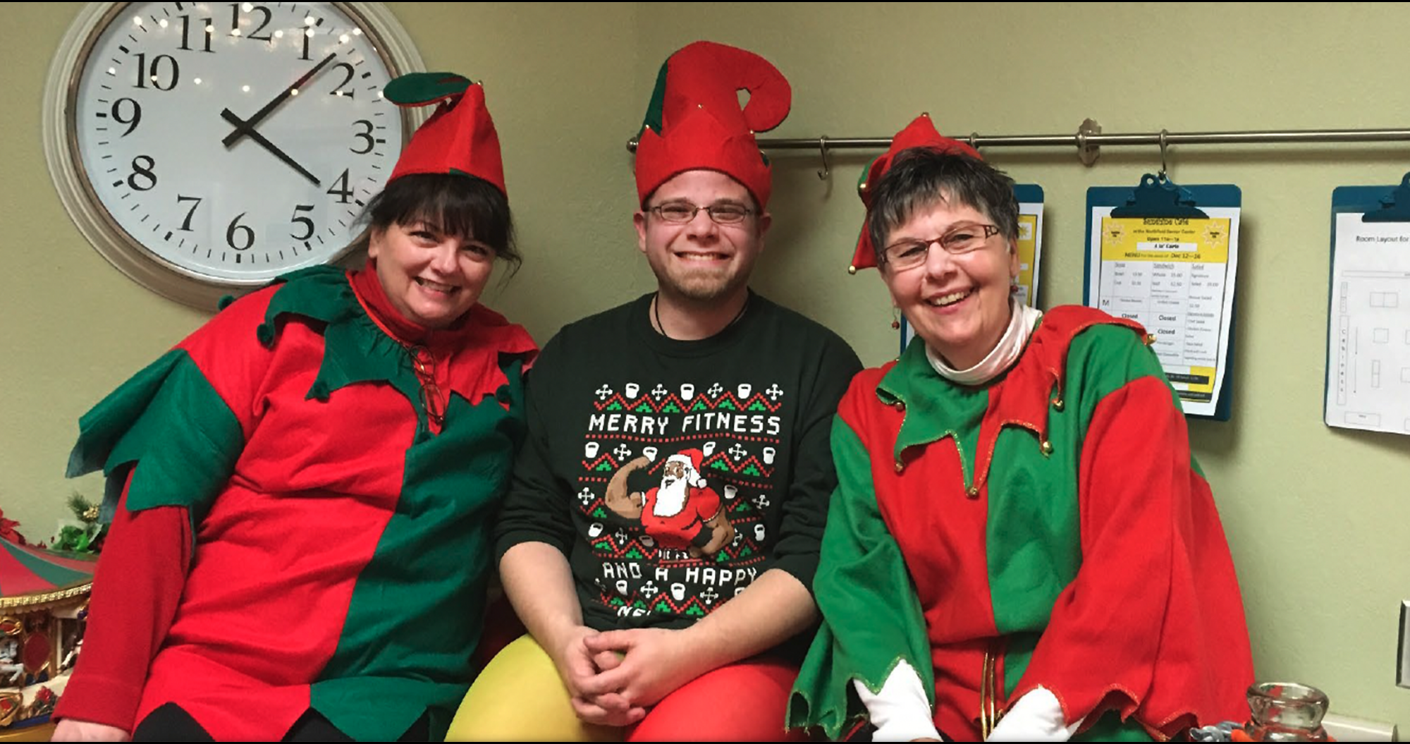 Elaine Meyers, Craig Swenson, and Lynne Pederson in elf costumes